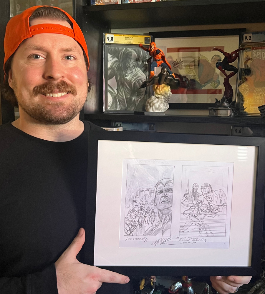 Collector's Club sketch winner displaying their framed original Alex Ross sketch