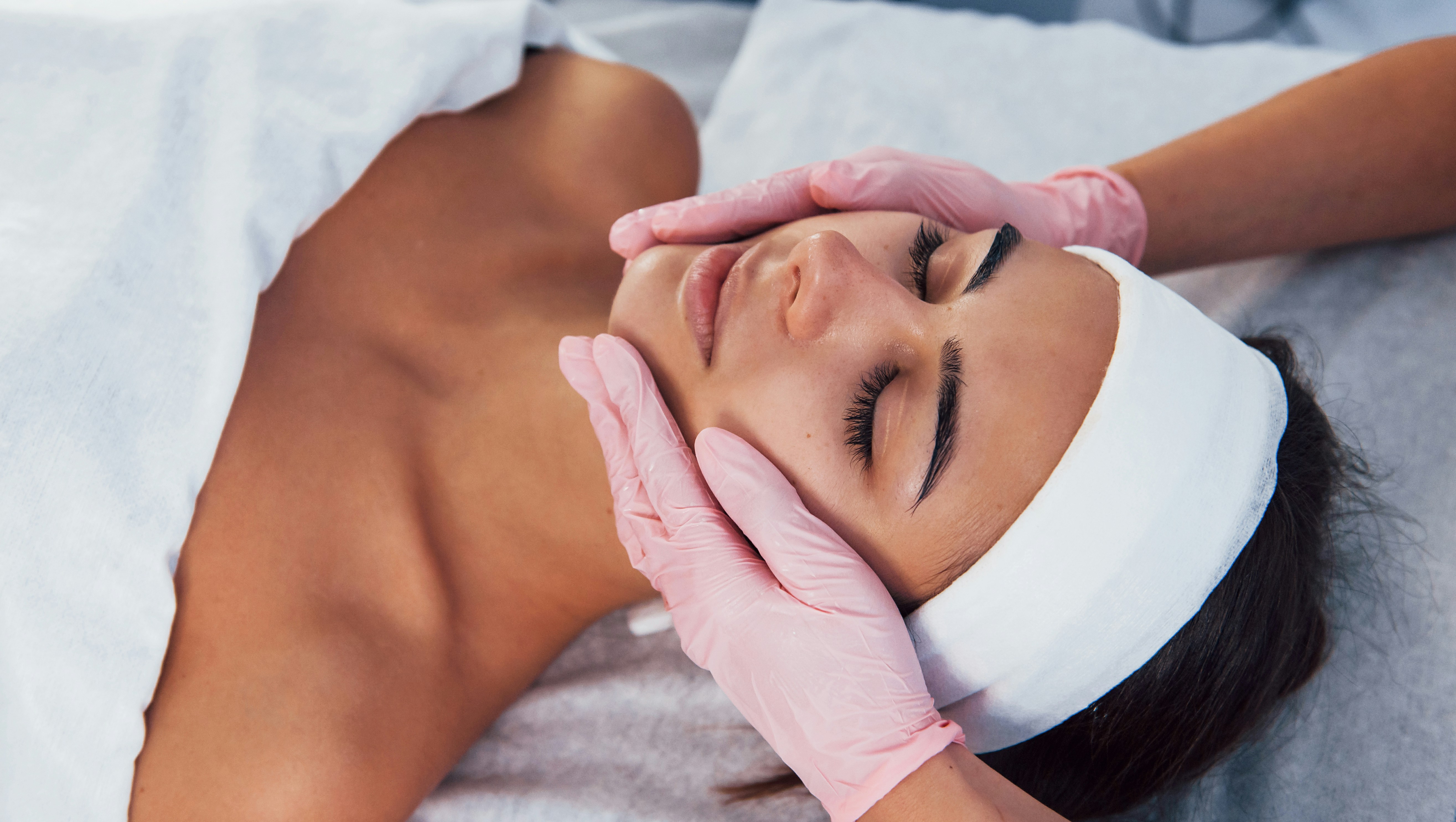 Patient receiving a professional facial skin treatment