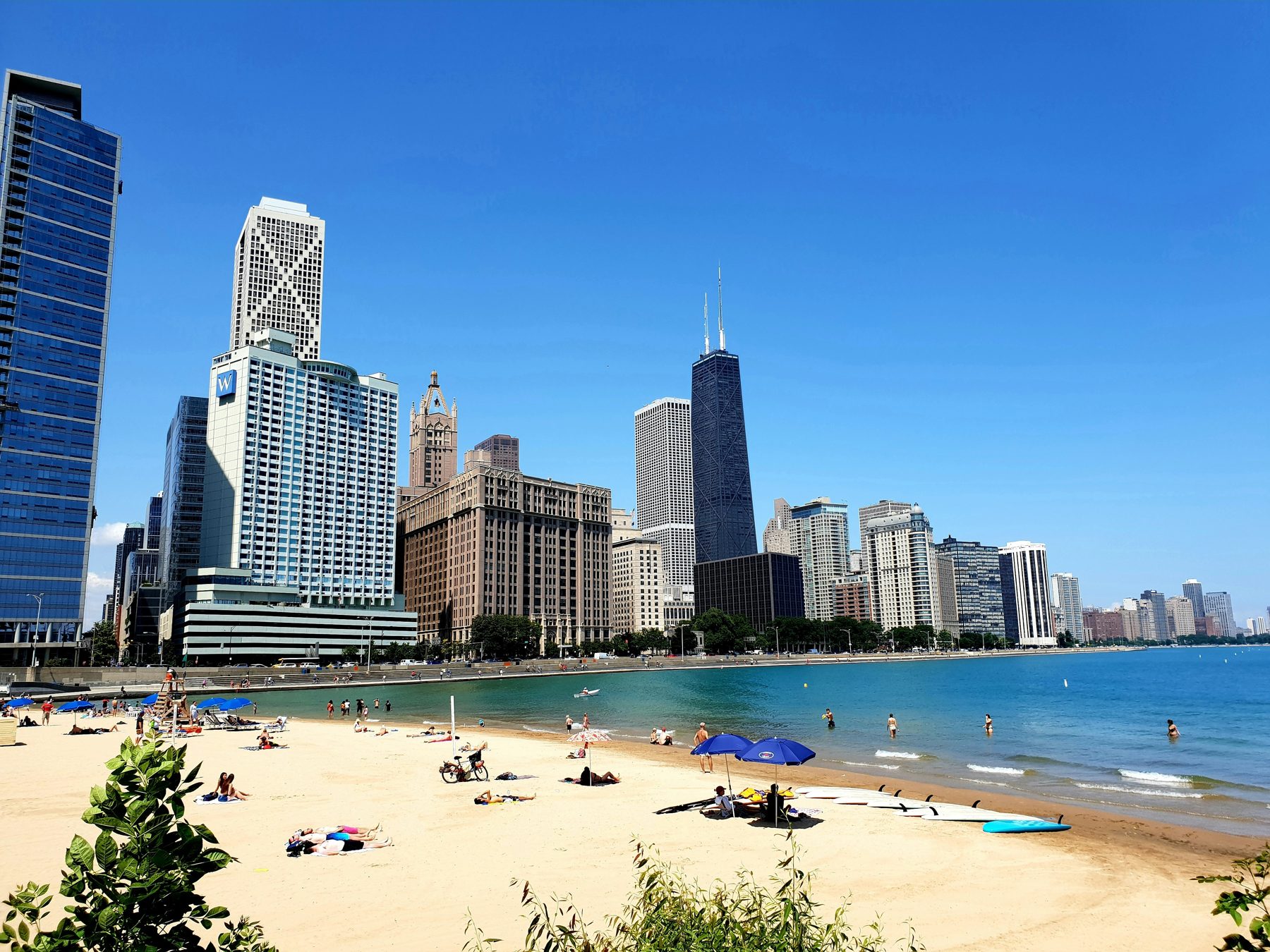 Chicago skyline and Oak Street Beach on a clear late-summer afternoon
