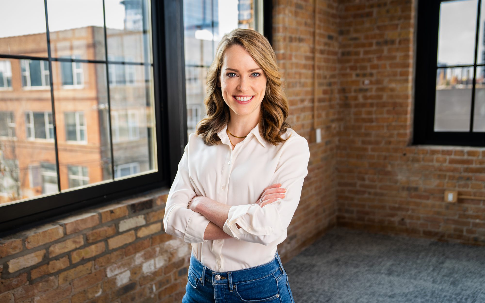 Professional headshot against simple backdrop