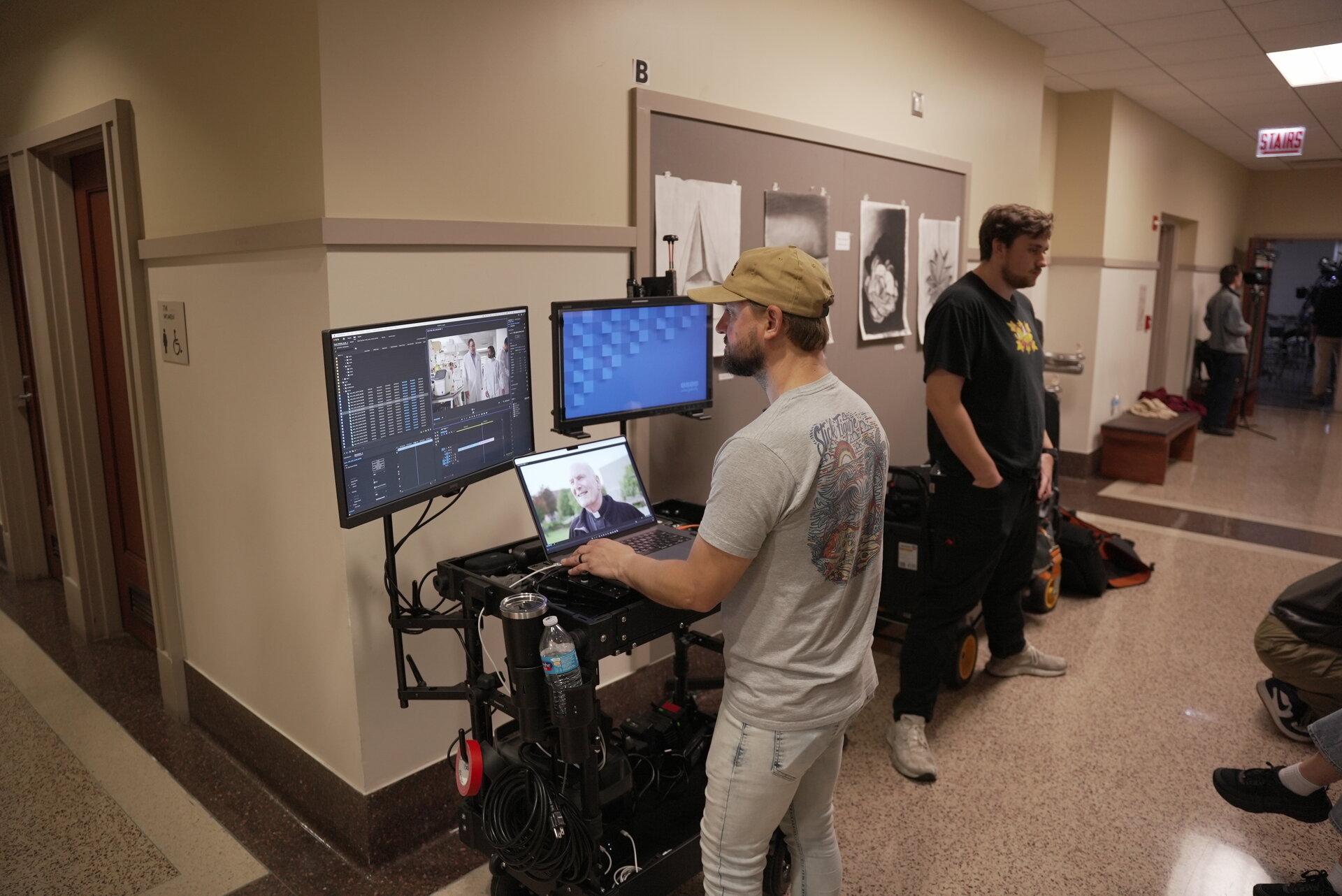 DIT station and monitors in campus hallway